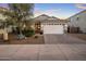 Charming single-story home with a well-manicured lawn, paved driveway, and a two-car garage at 537 E Balao Dr, Phoenix, AZ 85085