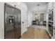 Eat-in kitchen area featuring stainless refrigerator and a cozy breakfast nook with outdoor views at 537 E Balao Dr, Phoenix, AZ 85085
