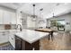 Bright kitchen with center island and open floor plan providing seamless access to the living room at 537 E Balao Dr, Phoenix, AZ 85085