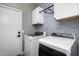 Well-equipped laundry room with modern washer and dryer units and ample storage at 537 E Balao Dr, Phoenix, AZ 85085