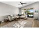 Living room with vaulted ceiling and view of the backyard with private pool at 537 E Balao Dr, Phoenix, AZ 85085