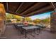 Outdoor dining area featuring tables, chairs, grill, and stone accents perfect for social gatherings at 537 E Balao Dr, Phoenix, AZ 85085