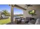 Cozy covered patio with comfortable seating and a view of the sparkling backyard pool at 537 E Balao Dr, Phoenix, AZ 85085