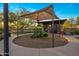 Community playground area with shade structure and a variety of play equipment for children at 537 E Balao Dr, Phoenix, AZ 85085