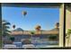 Stunning view from home featuring hot air balloons over desert landscape and pool at 537 E Balao Dr, Phoenix, AZ 85085