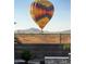 View from the backyard featuring a hot air balloon and desert scenery at 537 E Balao Dr, Phoenix, AZ 85085