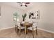 Elegant dining room with modern decor, neutral color palette, and stylish furnishings at 5423 W Yearling Rd, Phoenix, AZ 85083