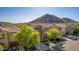 Beautiful home featuring desert landscaping, mature trees, and gorgeous mountain views at 5423 W Yearling Rd, Phoenix, AZ 85083
