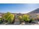 Charming two-story home with a well-manicured front yard and attached garage at 5423 W Yearling Rd, Phoenix, AZ 85083