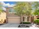 Two-story home featuring an attached two-car garage, meticulous landscaping, and inviting curb appeal at 5423 W Yearling Rd, Phoenix, AZ 85083