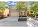 Charming two-story home featuring an attached two-car garage and a meticulously landscaped front yard at 5423 W Yearling Rd, Phoenix, AZ 85083