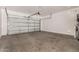 Spacious two car garage featuring high ceilings and ample room for storage at 5423 W Yearling Rd, Phoenix, AZ 85083
