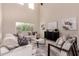 Living room with high ceilings, neutral paint, bright natural light and modern decor at 5423 W Yearling Rd, Phoenix, AZ 85083