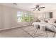 Serene primary bedroom with neutral tones, large windows, and stylish decor at 5423 W Yearling Rd, Phoenix, AZ 85083