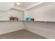 Spacious walk-in closet with white walls, neutral carpet, and shelving at 5423 W Yearling Rd, Phoenix, AZ 85083
