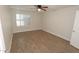 Bright bedroom with wood flooring, recessed lights, and a modern ceiling fan at 5718 N 72Nd Pl, Scottsdale, AZ 85250
