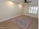 Bedroom with wood flooring, recessed lights, a modern ceiling fan, and bright shutters at 5718 N 72Nd Pl, Scottsdale, AZ 85250