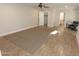 Spacious bedroom featuring wood floors, a ceiling fan, and walk-in closet at 5718 N 72Nd Pl, Scottsdale, AZ 85250