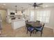 Charming eat-in kitchen featuring white cabinets, stainless steel appliances, granite countertops, and a dark breakfast table at 5718 N 72Nd Pl, Scottsdale, AZ 85250