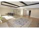 Open living and dining area with tiled floors, beamed ceilings, and ample natural light at 5718 N 72Nd Pl, Scottsdale, AZ 85250