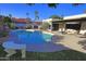Inviting backyard pool with lush landscaping, patio area, and ample space for outdoor relaxation and entertaining at 5718 N 72Nd Pl, Scottsdale, AZ 85250