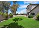 Lush backyard features a manicured lawn with ample space for recreation and relaxation at 5751 E Ludlow Dr, Scottsdale, AZ 85254