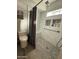 Beautifully tiled bathroom with shower and built-in shower bench and storage at 5751 E Ludlow Dr, Scottsdale, AZ 85254