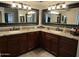 Dual sinks with granite countertops and plenty of lighting at 5751 E Ludlow Dr, Scottsdale, AZ 85254