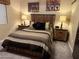 Bedroom with a rustic wood bed frame and matching decor at 5751 E Ludlow Dr, Scottsdale, AZ 85254