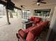 Inviting covered patio with comfortable seating, ceiling fans, and a view of the pool through sliding glass doors at 5751 E Ludlow Dr, Scottsdale, AZ 85254