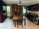 Entertain in this stylish kitchen and dining space with a long table and chairs, stone accents and mini beverage cooler at 5751 E Ludlow Dr, Scottsdale, AZ 85254