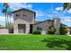 Charming two-story home with well-maintained lawn, mature trees, and a side-entry garage at 5751 E Ludlow Dr, Scottsdale, AZ 85254