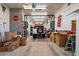 Organized garage with ample storage, shelving, and room for vehicle parking at 5751 E Ludlow Dr, Scottsdale, AZ 85254