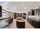 Expansive kitchen featuring granite countertops, an island, tile floors, and stainless steel appliances at 5751 E Ludlow Dr, Scottsdale, AZ 85254
