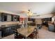 Open-concept kitchen and dining area with granite counters, dark cabinetry, and modern appliances at 5751 E Ludlow Dr, Scottsdale, AZ 85254