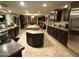 Open kitchen boasts expansive countertops, dark cabinets and stainless steel appliances, perfect for cooking and entertaining at 5751 E Ludlow Dr, Scottsdale, AZ 85254