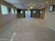 Spacious living room featuring ceiling fans, recessed lighting and a large sliding barn door at 5751 E Ludlow Dr, Scottsdale, AZ 85254