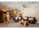 Comfortable living room with plush sofas, ceiling fans and a staircase leading to the upper level at 5751 E Ludlow Dr, Scottsdale, AZ 85254