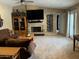 A well-decorated living room featuring a cozy fireplace, built-in shelving, plush seating, and modern decor at 5751 E Ludlow Dr, Scottsdale, AZ 85254