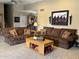A cozy living room featuring two plush sofas, patterned pillows, and a decorative wooden coffee table at 5751 E Ludlow Dr, Scottsdale, AZ 85254