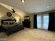 Comfortable main bedroom with access to the backyard and black furniture at 5751 E Ludlow Dr, Scottsdale, AZ 85254