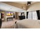 Bright primary bedroom with ceiling fan, recessed lighting, dresser, and neutral carpet flooring at 5751 E Ludlow Dr, Scottsdale, AZ 85254