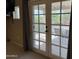 Close-up of glass patio doors leading to an outdoor seating area, bringing the outdoors in at 5751 E Ludlow Dr, Scottsdale, AZ 85254