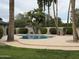Backyard oasis featuring a private pool, mature landscaping, and large deck at 5751 E Ludlow Dr, Scottsdale, AZ 85254