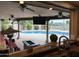 Enjoy this covered patio and full outdoor kitchen overlooking the sparkling pool, perfect for entertaining guests at 5751 E Ludlow Dr, Scottsdale, AZ 85254