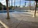 Backyard oasis featuring a private pool, mature landscaping, string lights, and large deck at 5751 E Ludlow Dr, Scottsdale, AZ 85254