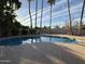 Backyard oasis featuring a private pool, mature landscaping, and large deck at 5751 E Ludlow Dr, Scottsdale, AZ 85254