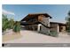 Rendering showcasing the exterior of the car barn and organic garden, with modern architectural design at 6228 N Cattle Track Rd, Scottsdale, AZ 85250