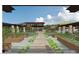 Rendering of a serene organic garden with raised beds and a pathway leading to the car barn at 6228 N Cattle Track Rd, Scottsdale, AZ 85250