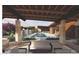 Rendering of a beautiful pool and pool pavilion with comfortable outdoor seating and lush landscaping at 6228 N Cattle Track Rd, Scottsdale, AZ 85250